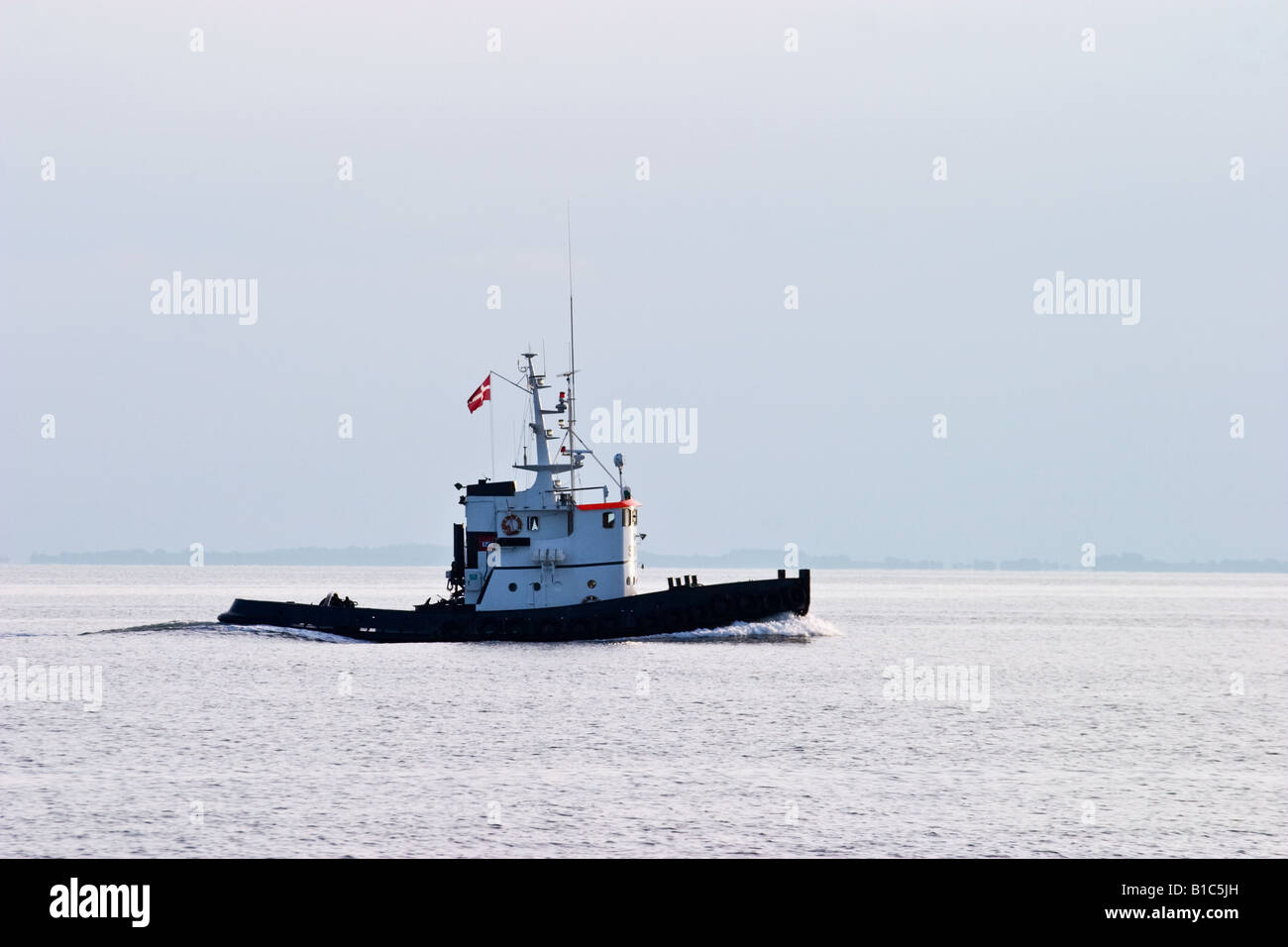 Tugboat at sea Stock Photo - Alamy