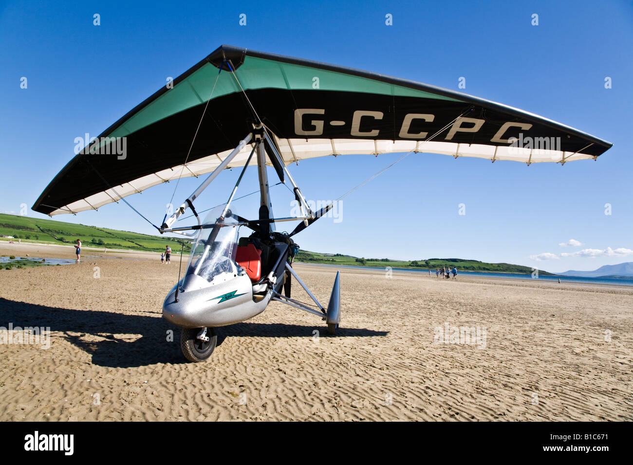 A silver Quik microlight aircraft on the beach at Ettrick Bay, Isle of ...