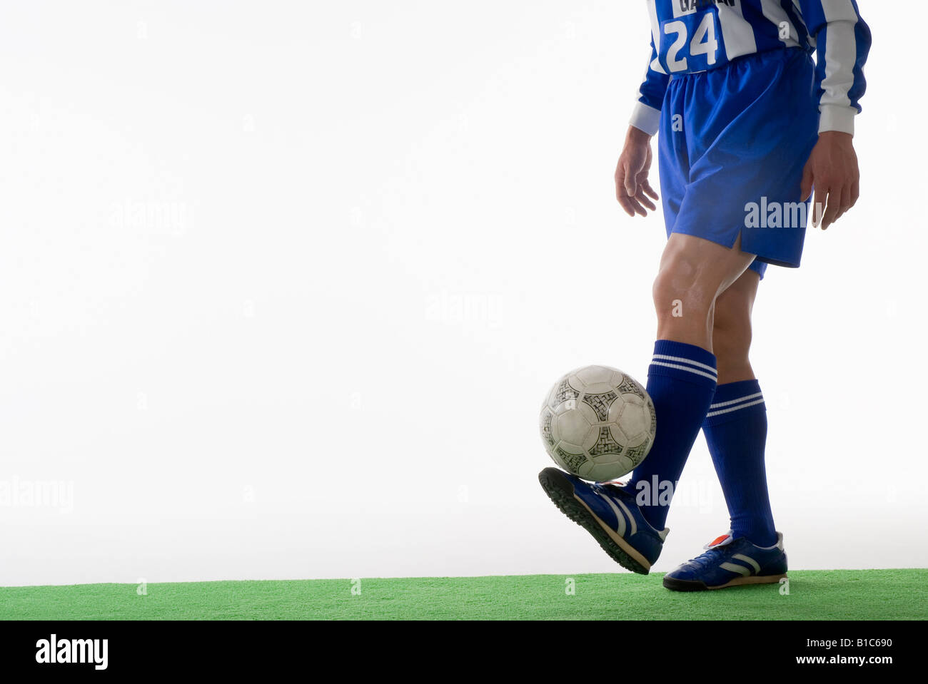 Soccer player juggling ball Stock Photo Alamy