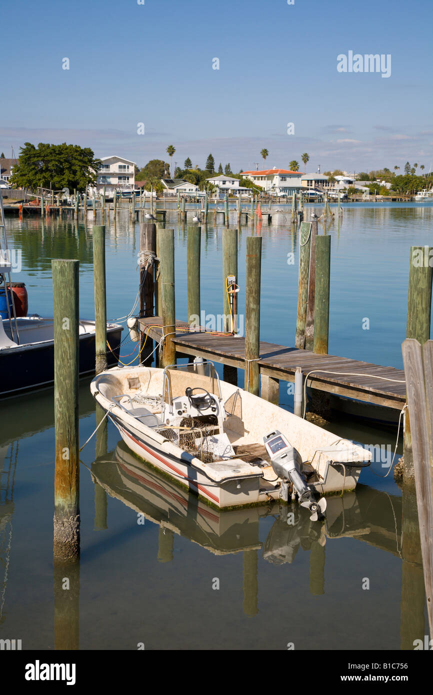 Boat docked at pier in Boca Ciega Bay near Treasure Isalnd in Florida, USA Stock Photo