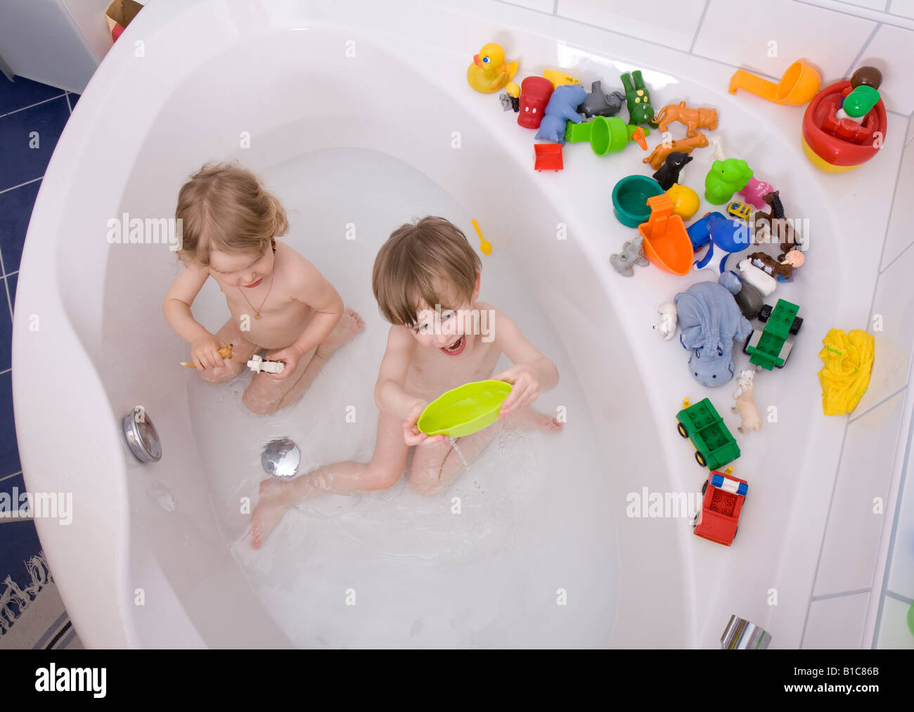 little children playing in bath tub Stock Photo