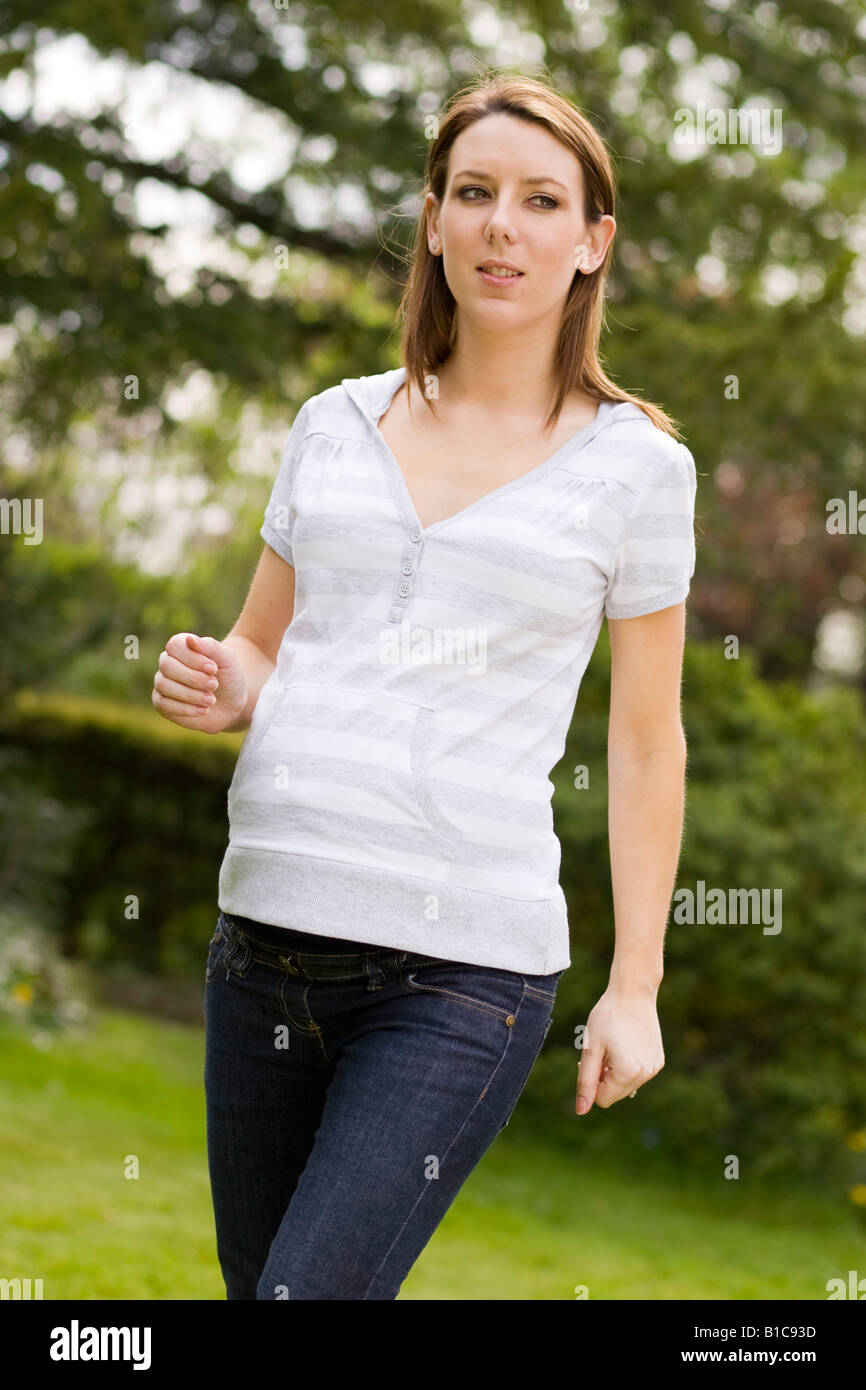 Pregnant woman taking exercise Stock Photo