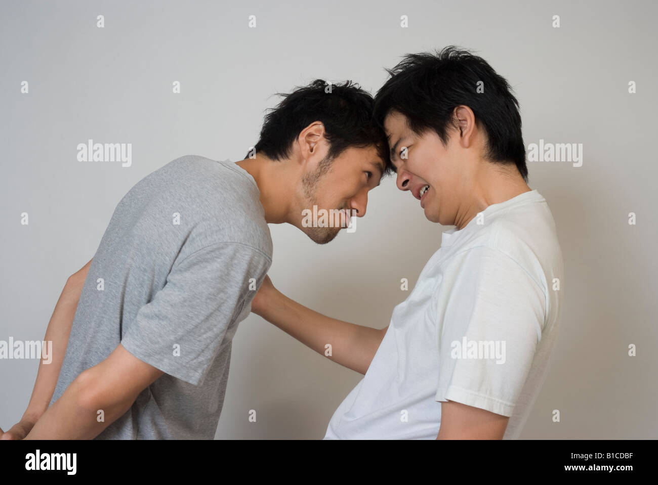 Two young men glaring Stock Photo