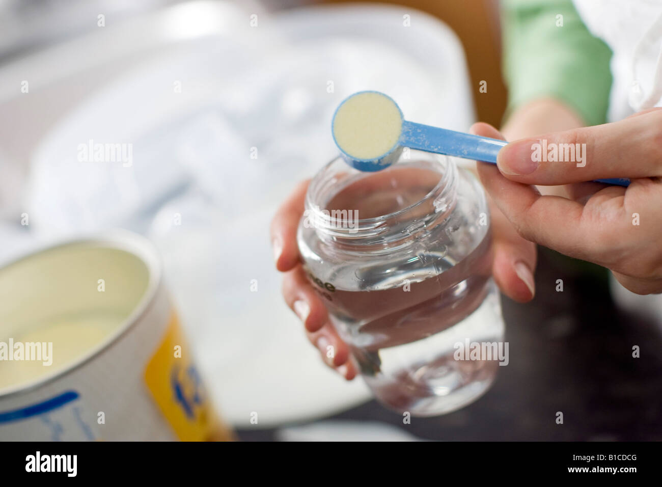 woman making up baby bottles Stock Photo Alamy