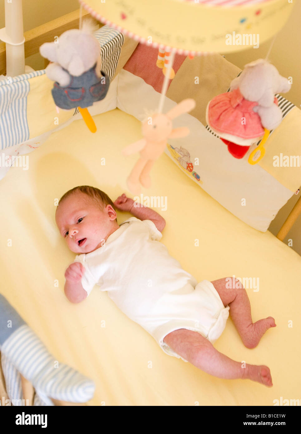Baby girl asleep in cot hi-res stock photography and images - Alamy