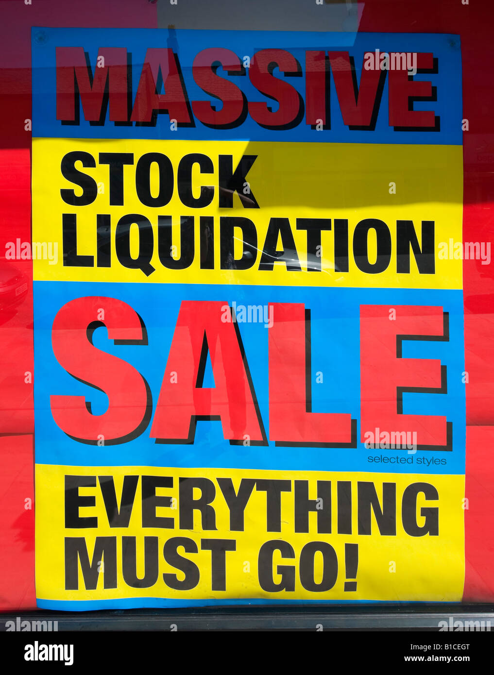 Sign in High Street Shop advertising stock liquidation and sale, Glossop, Derbyshire, England, United Kingdom Stock Photo