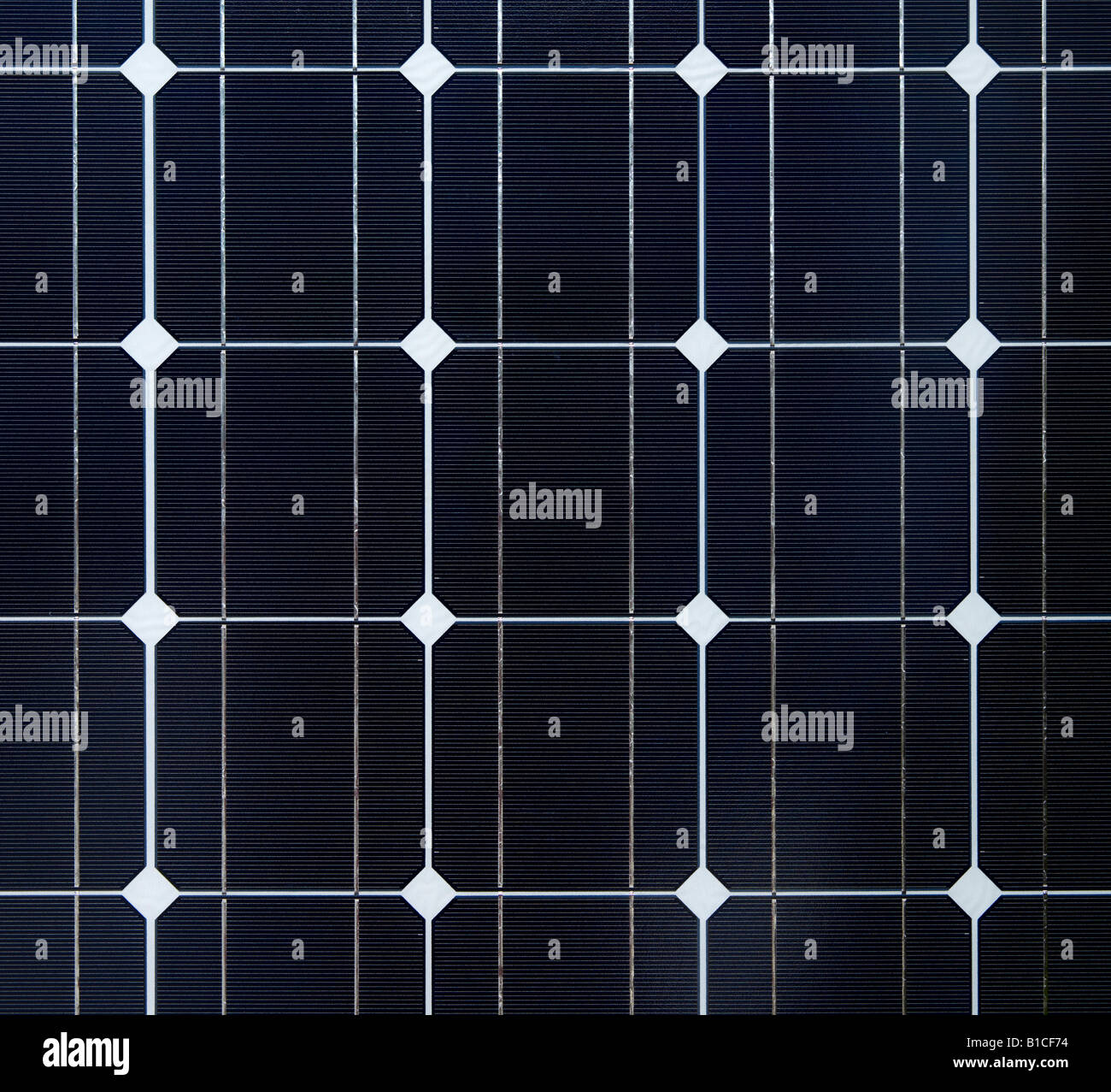 Close up of an array of Photovoltic cells solar Panel photographed straight on Stock Photo