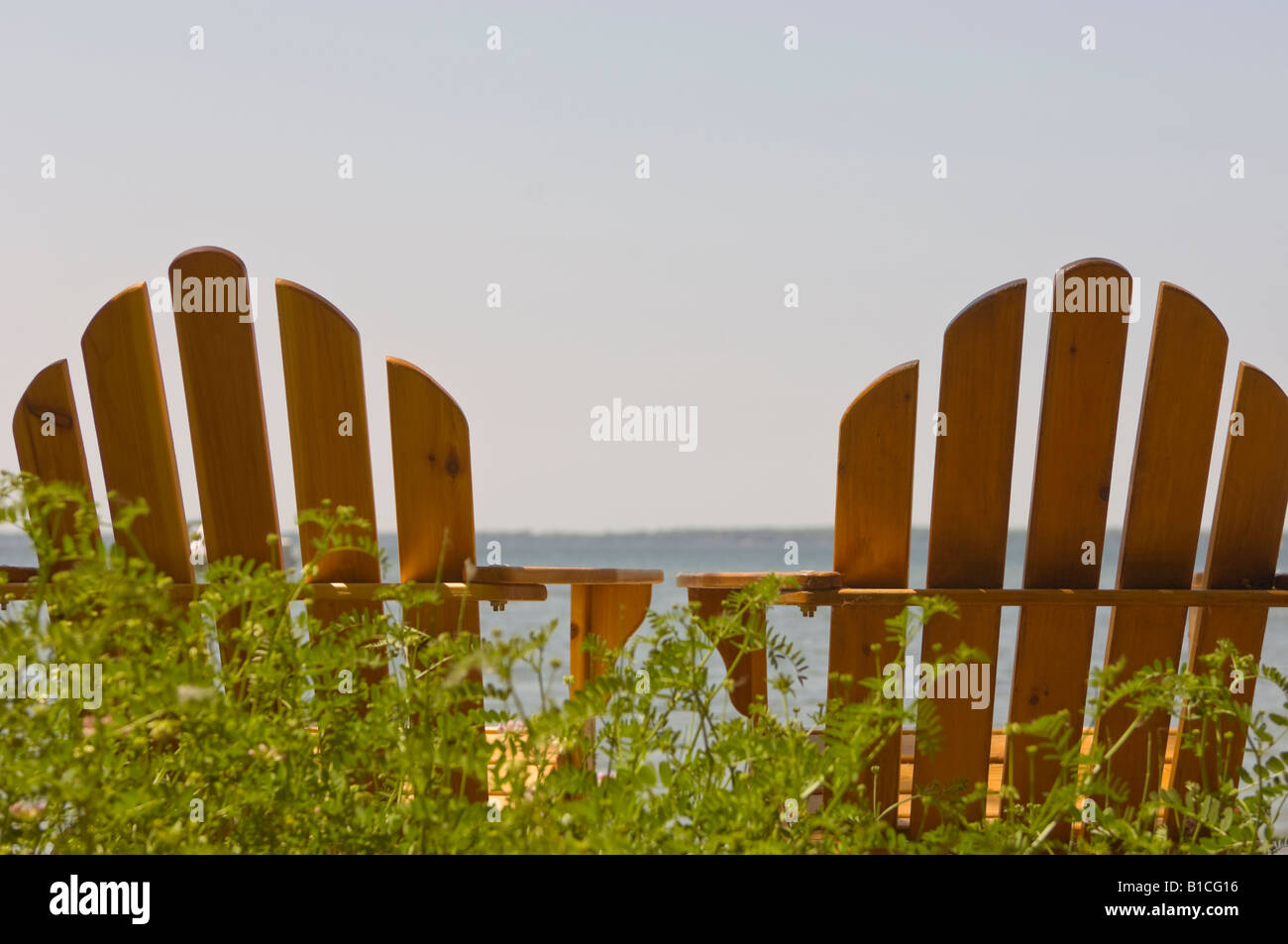 TWO ADIRONDACK CHAIRS NEAR LAKE Stock Photo - Alamy