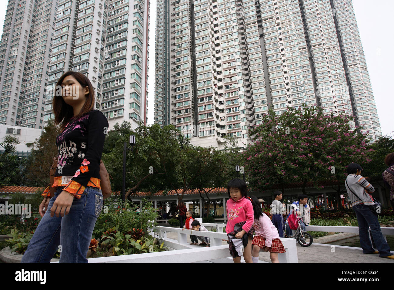 People in a park between blocks of flats in Kowloon district, Hong Kong, China Stock Photo