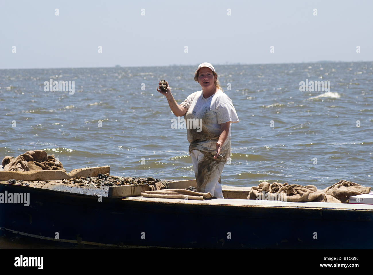 a working oyster tongers boat in Apalachicola Bay along North Florida