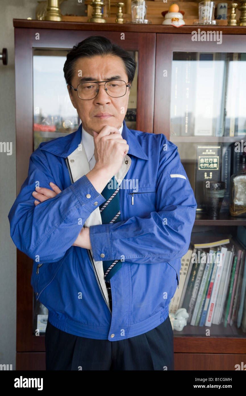 Mature man with his hand on chin Stock Photo