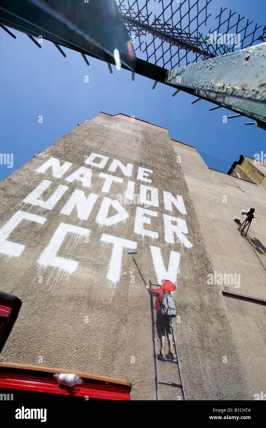 One Nation Under CCTV graffiti by Banksy. Newman Street, London, W1 England Stock Photo Alamy