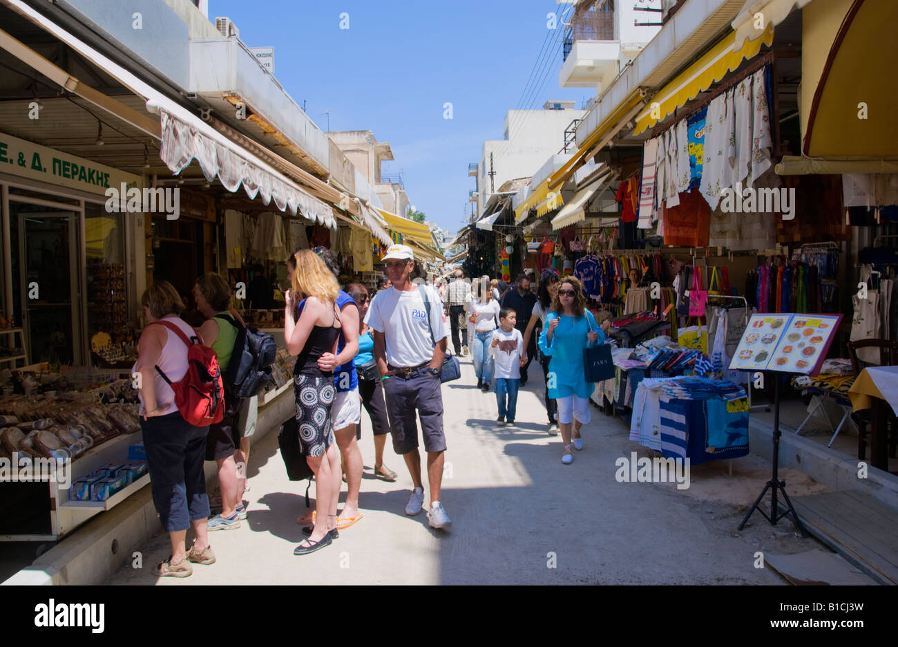 Shops opening onto narrow street giving market feel in Heraklion
