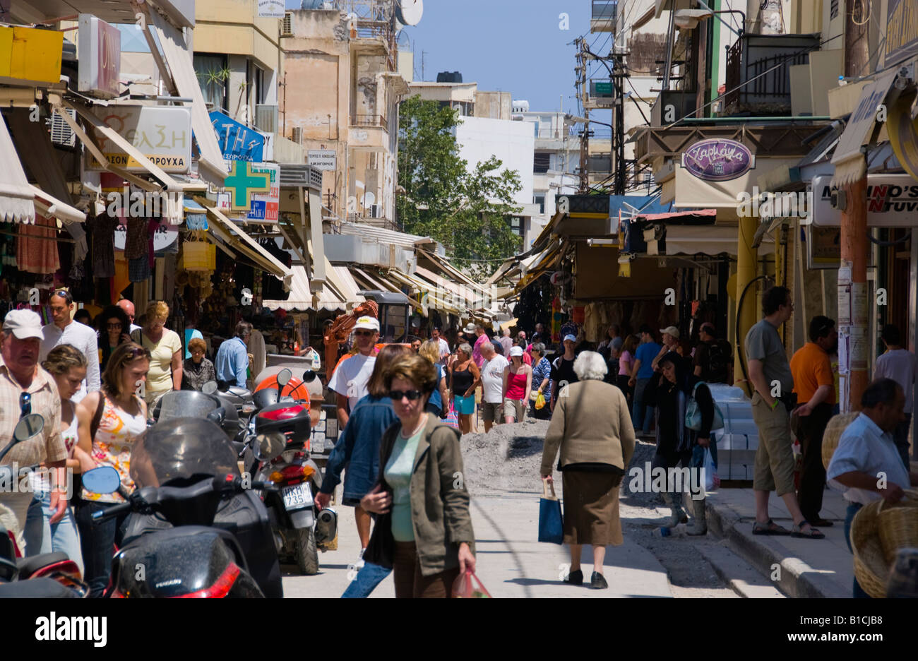 Shops opening onto narrow street giving market feel in Heraklion