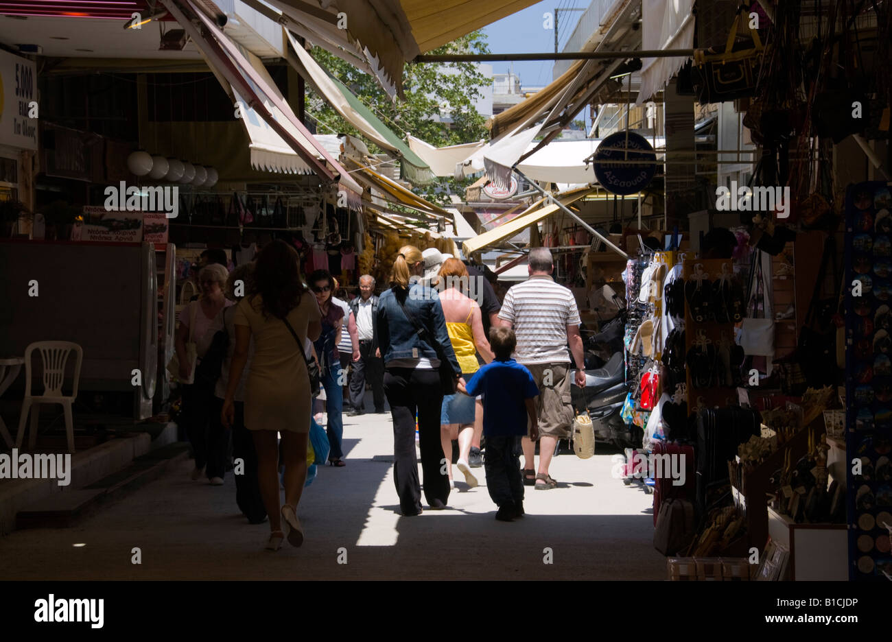Shops opening onto narrow street giving market feel in Heraklion