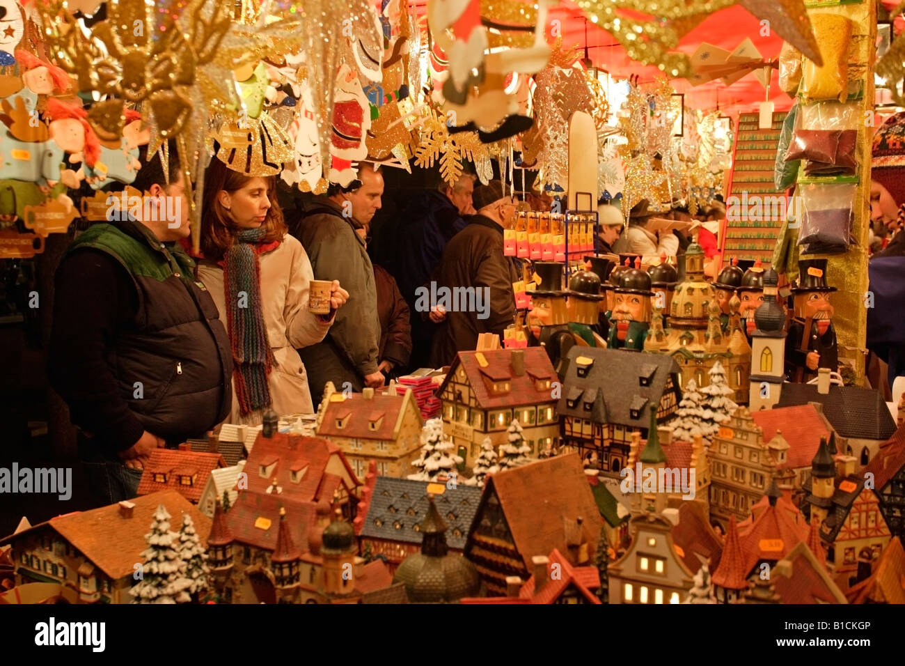 Hans Müller crafting a Christmas ornament in his workshop