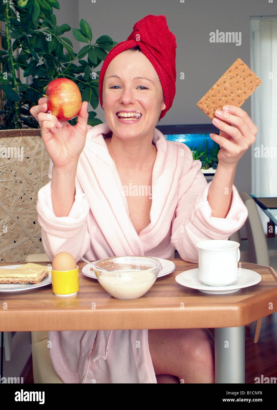 young woman at substantial breakfast Stock Photo