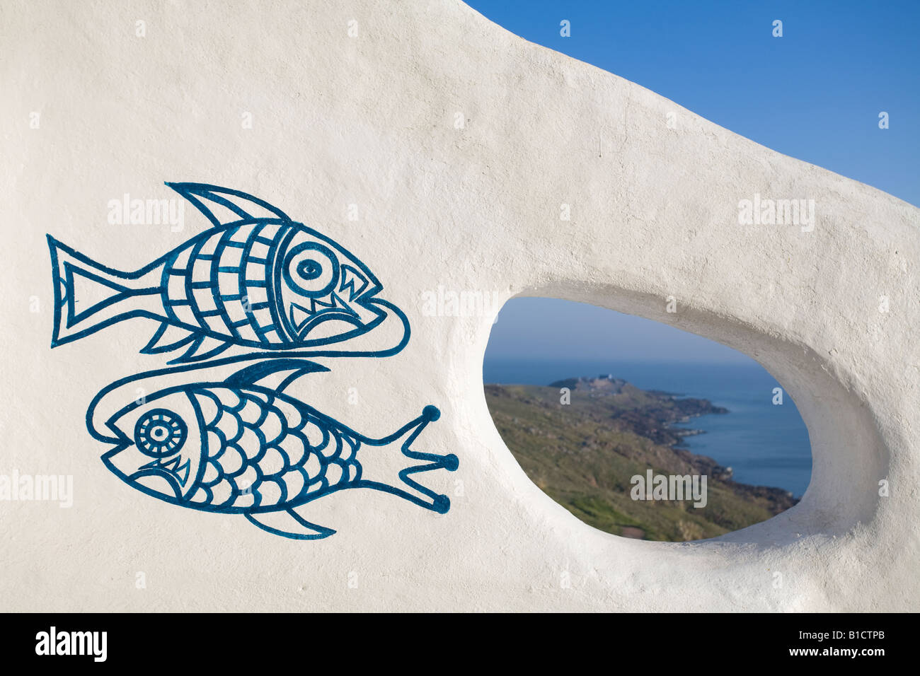 View of Punta Ballena through one of the many holes that can be found in the walls of Casapueblo Punta del Este Uruguay Stock Photo