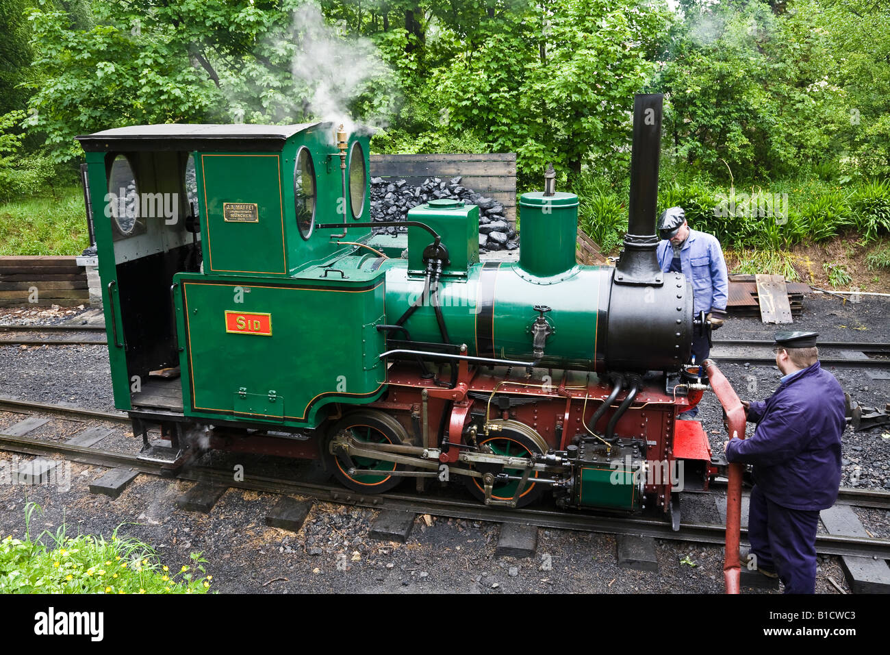 Engine taking on water at Woody Bay station, Lynton and Barnstaple Railway, Devon, England Stock Photo