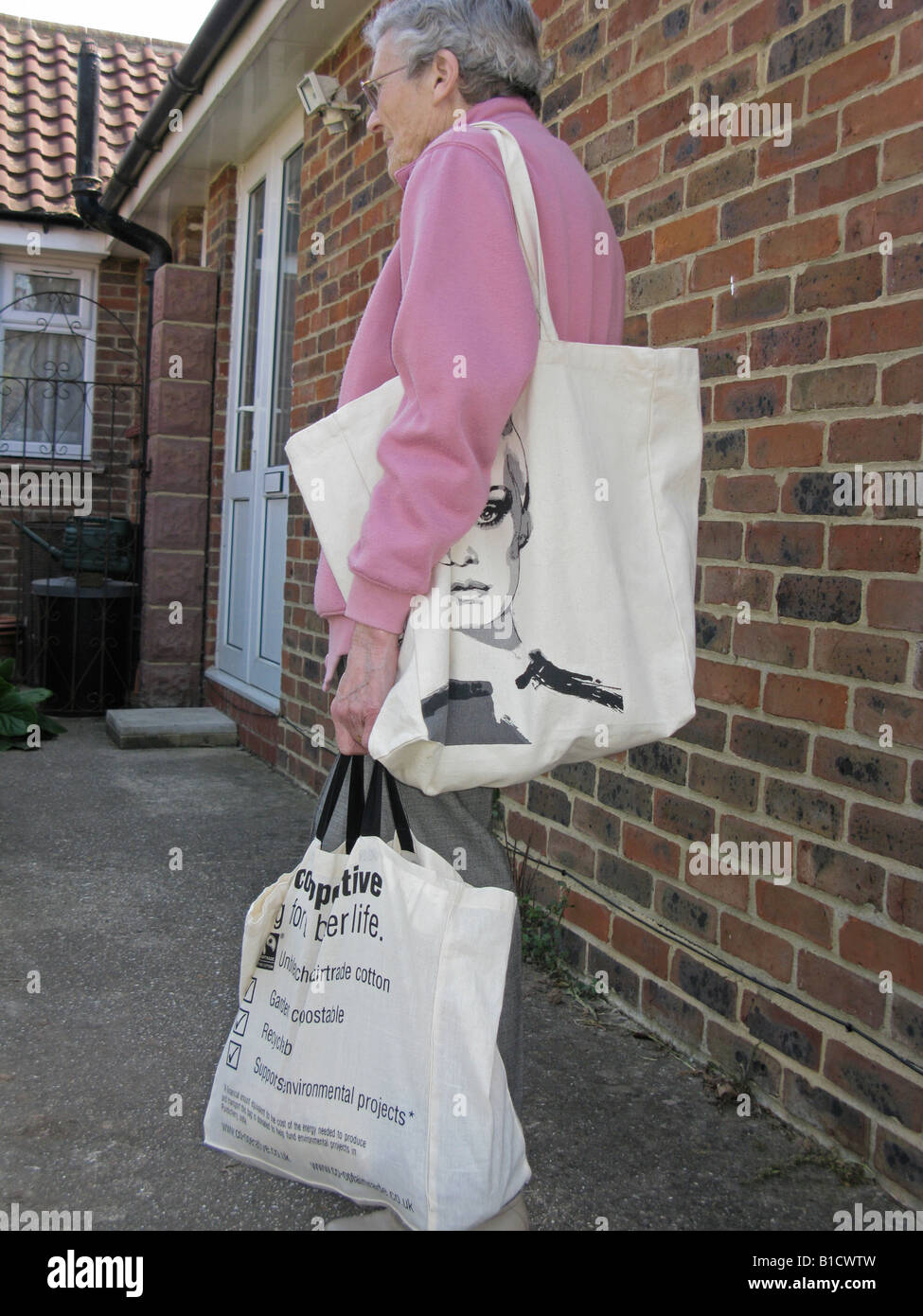 elderly woman with Fairtrade reusable environmentally friendly shopping