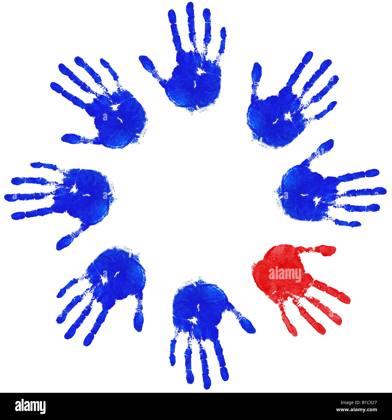 Images of blue handprints with an odd red one concepts of Teamwork Equality and Diversity Stock Photo