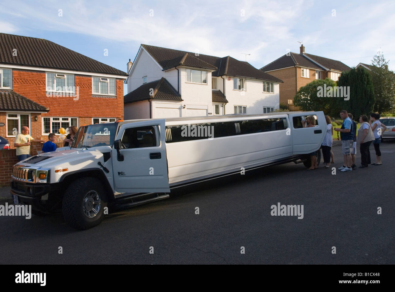 Prom party UK 2000s. Limo will take  sixteen year old teenage girls going to a leaving school prom Surrey 2008 UK  HOMER SYKES Stock Photo