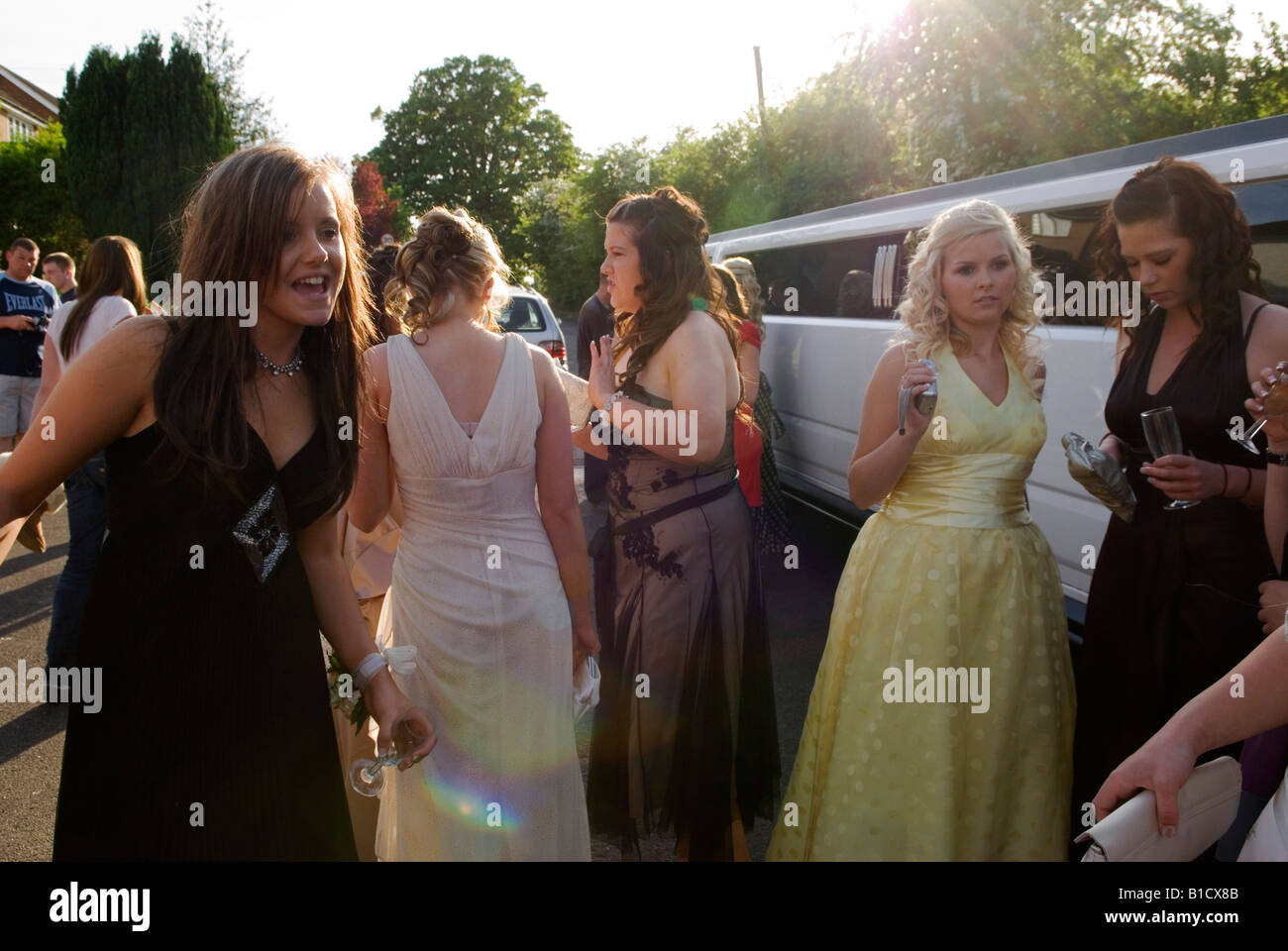 Prom party UK 2000s. Limo will take  sixteen year old teenage girls going to a leaving school prom Surrey 2008 UK  HOMER SYKES Stock Photo