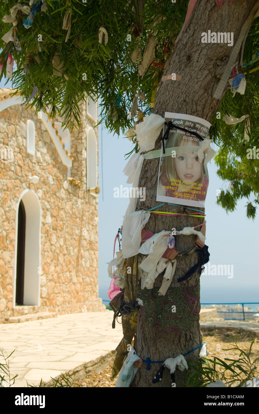 Madeleine McCann Poster and Colourful Rags Tied to a Memory Tree in Front of the Church of the Prophet Elijah Protaras Cyprus Stock Photo