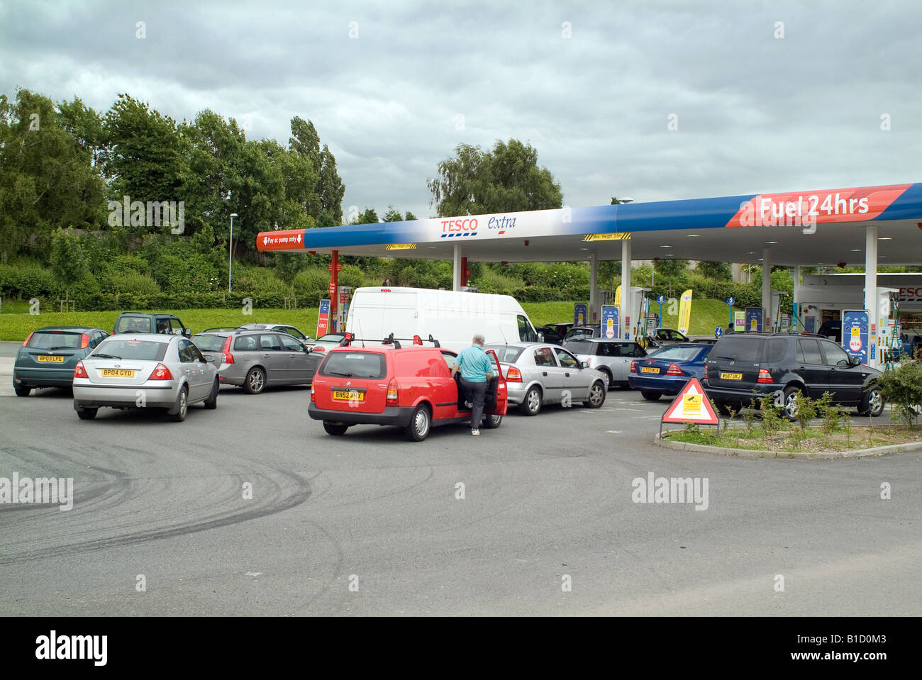 Queue of cars at petrol filling station Stock Photo