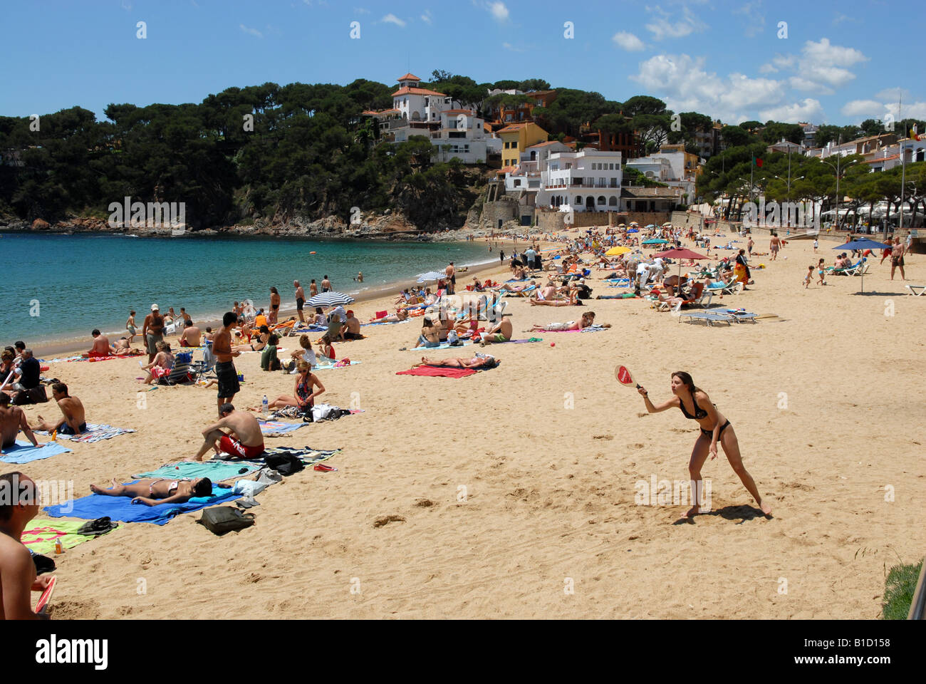 Holiday makers on the beach at Llafranc on the Costa Brava Spain Stock Photo