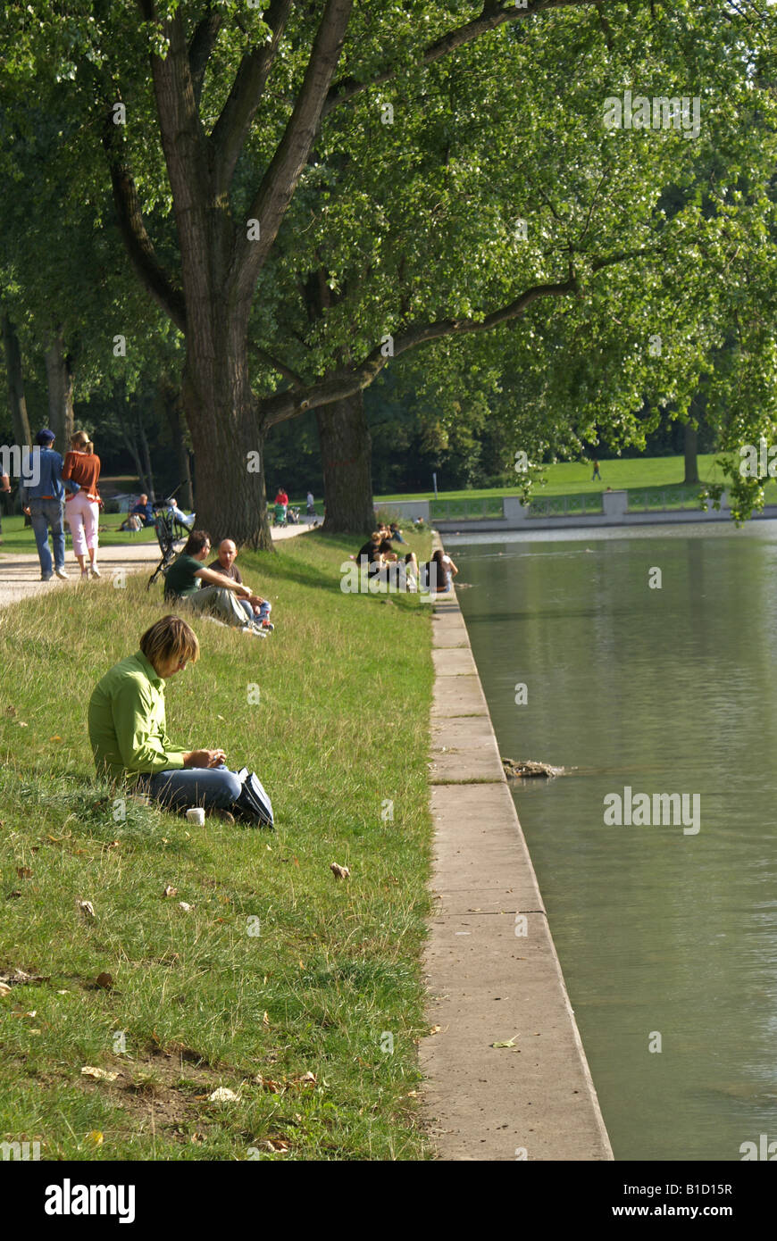 people enjoying a sunny day at the Aachener Weiher park, in Cologne - Germany Stock Photo