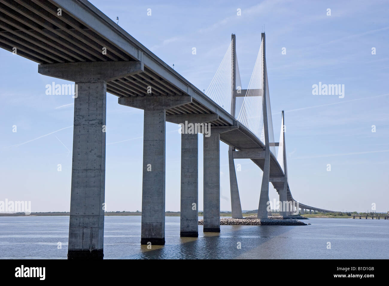 A new concrete and suspension bridge spanning a waterway Stock Photo ...
