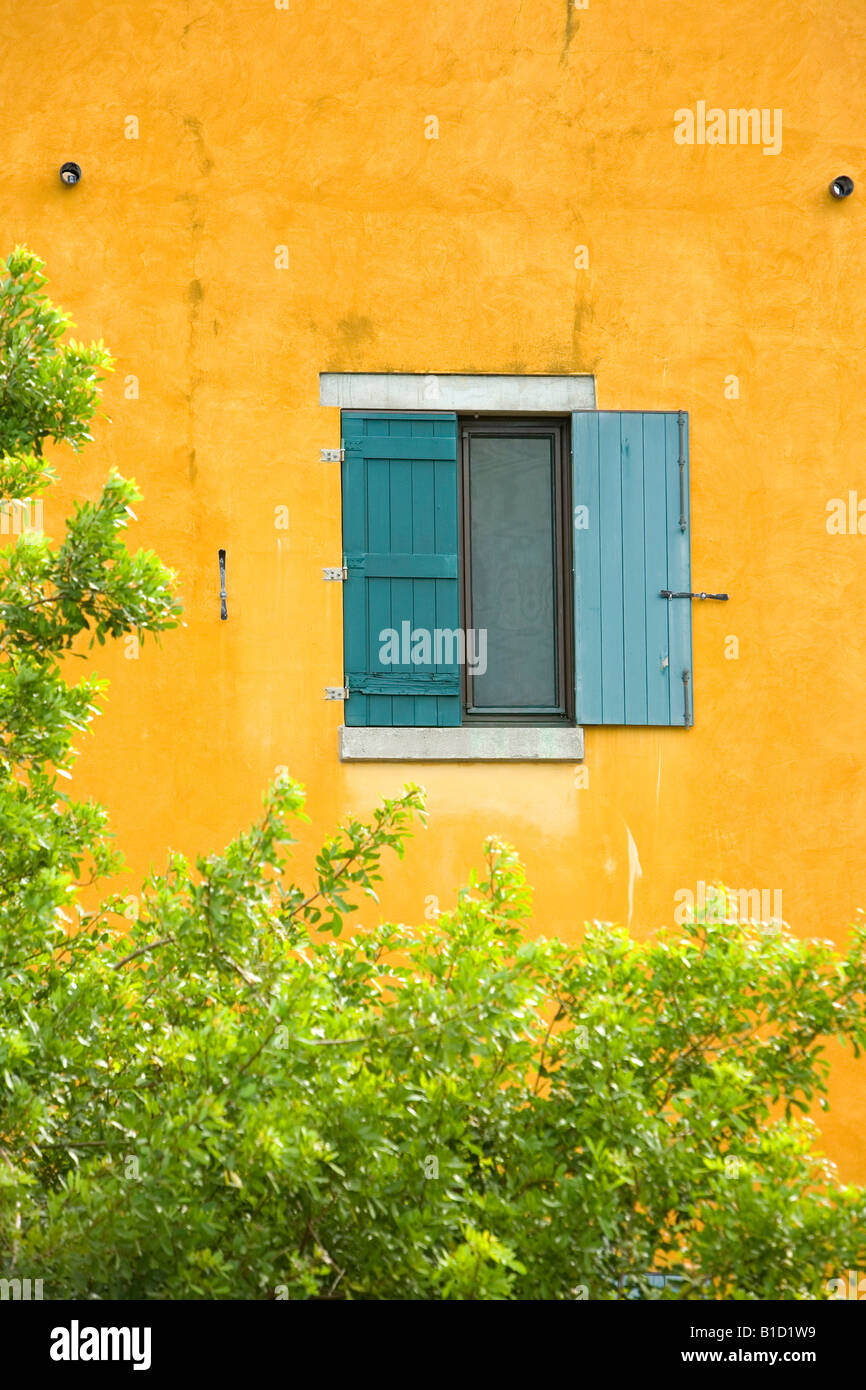 Serene window on orange building Stock Photo
