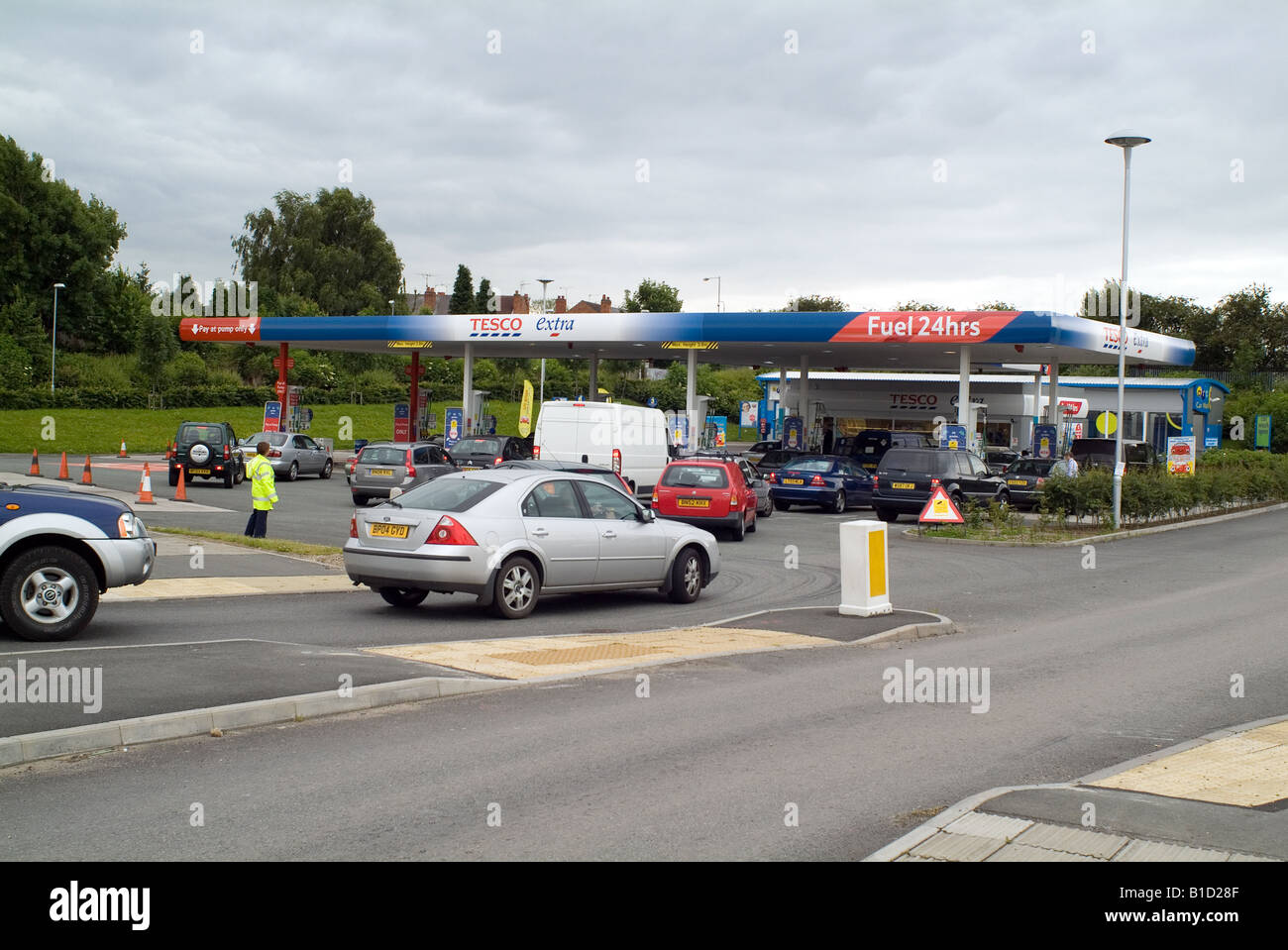 Queue of cars at petrol filling station Stock Photo