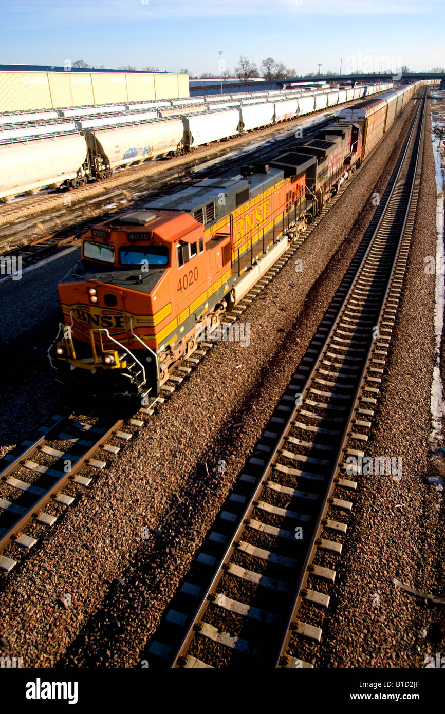 A BNSF auto train rolls through Streator, IL. Stock Photo