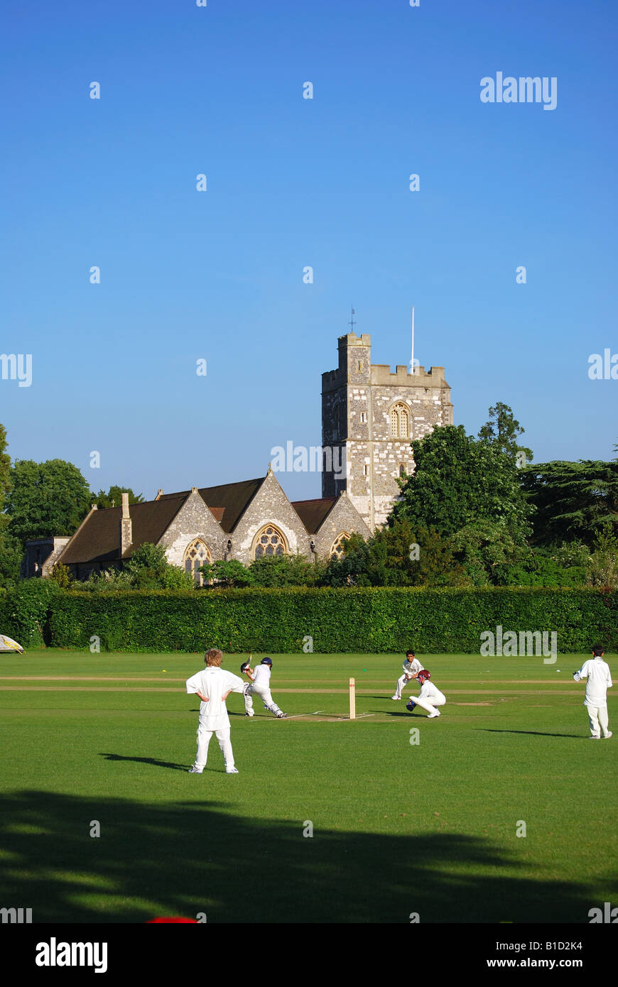 Cricket match on Green showing Bray Church, Bray, Berkshire, England, United Kingdom Stock Photo