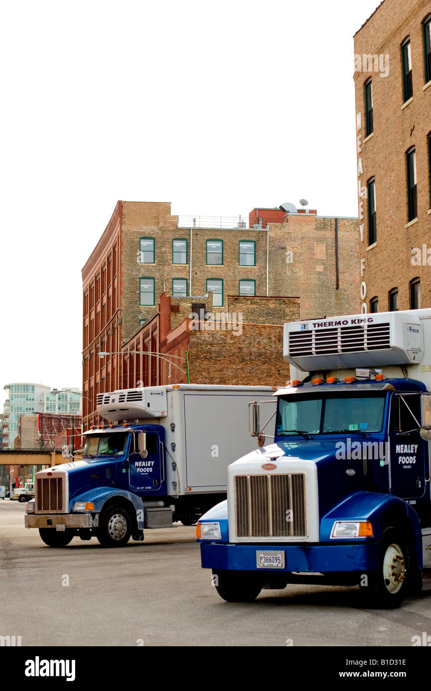 Two freezer trucks sit in the meat packing district of Chicago, IL. Stock Photo