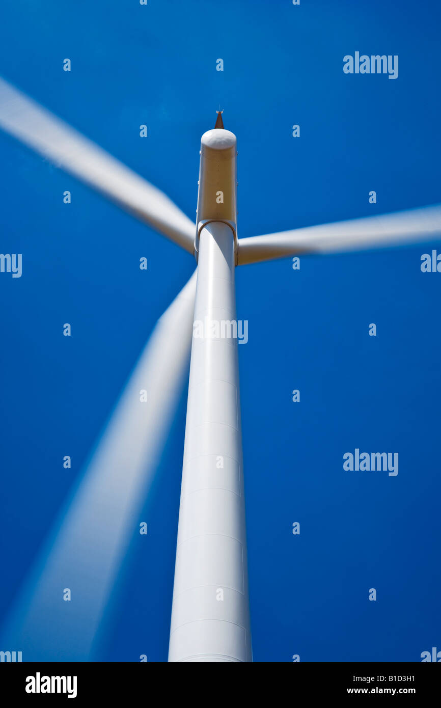 Close-up of wind turbine with blades turning against a cloudless deep blue sky at Westmill Wind Farm, Shrivenham, Oxfordshire Stock Photo