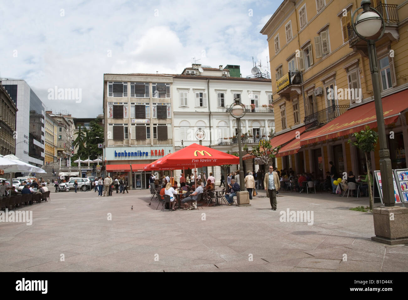 Rijeka Istria Croatia Europe May People dining out at the McDonalds restaurant in a square off Korzo Street in city centre Stock Photo