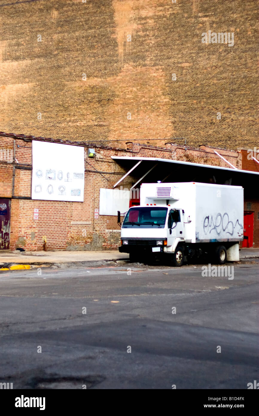 A small refrigerated truck sits on a side street in the meat packing district of Chicago, IL. Stock Photo