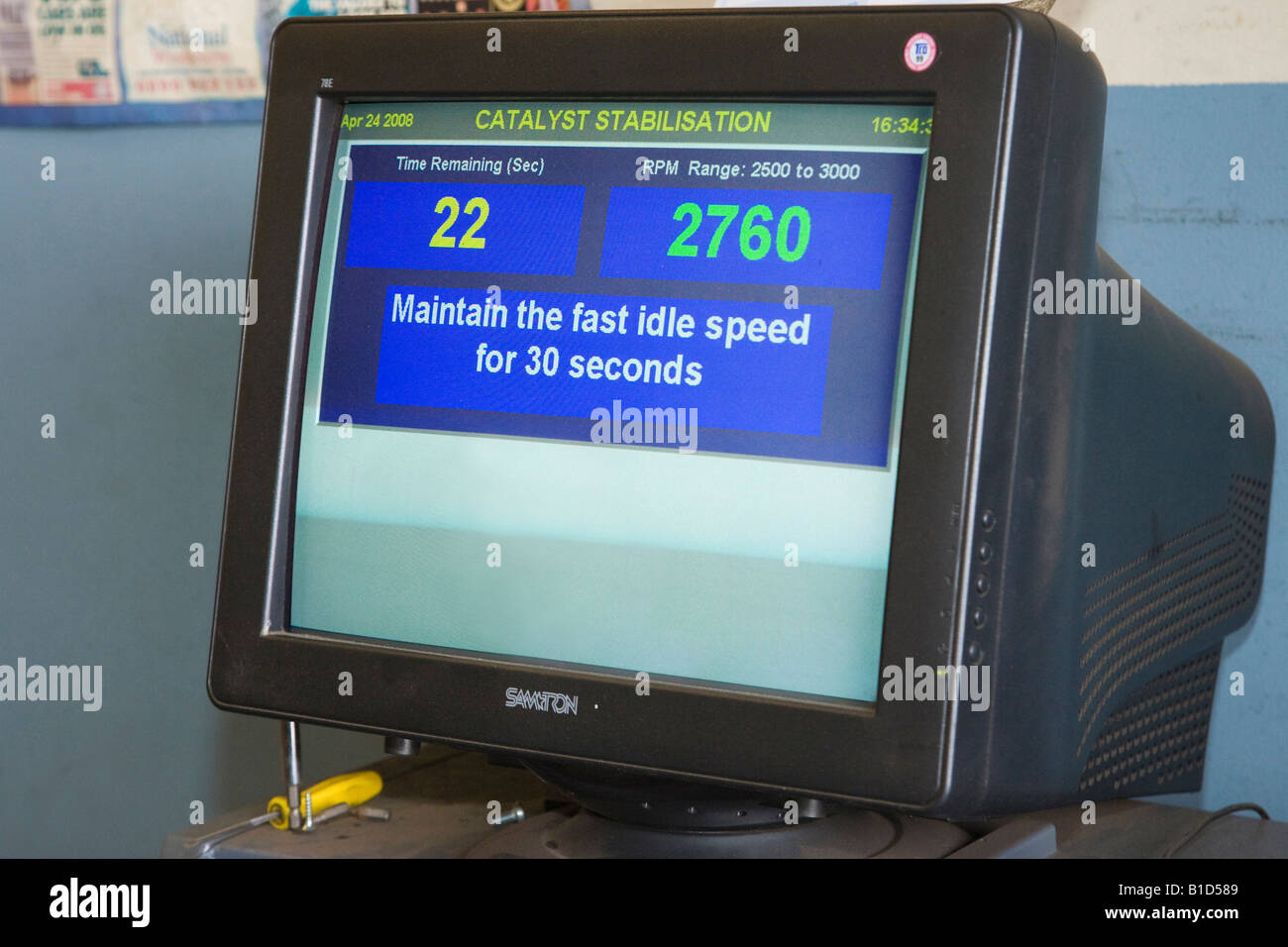 exhaust emissions test equipment being used during an MOT check for a car Stock Photo