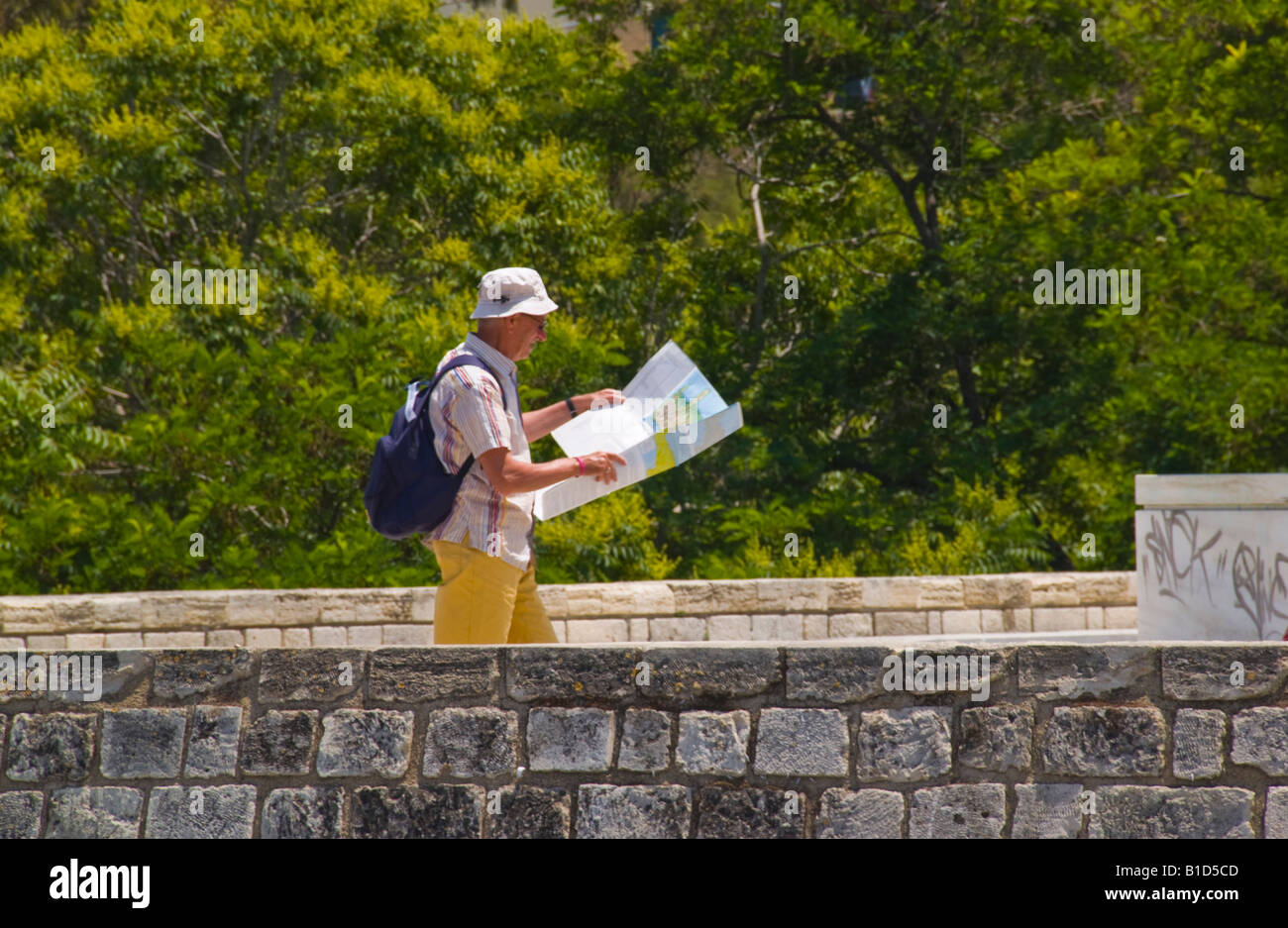 Tourist looking at map in Heraklion capital and largest city on the Greek Mediterranean island of Crete Stock Photo
