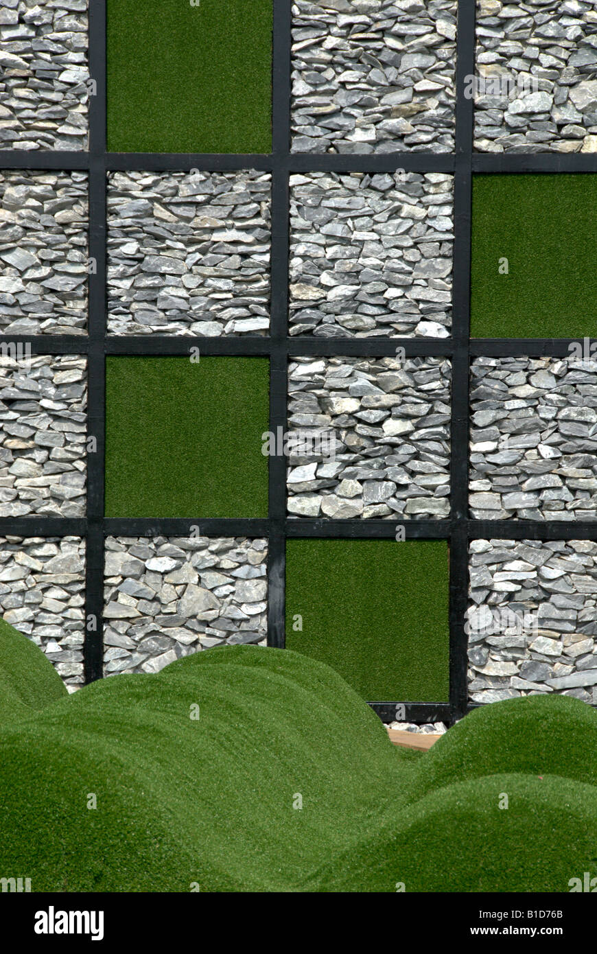 Designer garden featuring small grassy mounds and a checker patterned ...