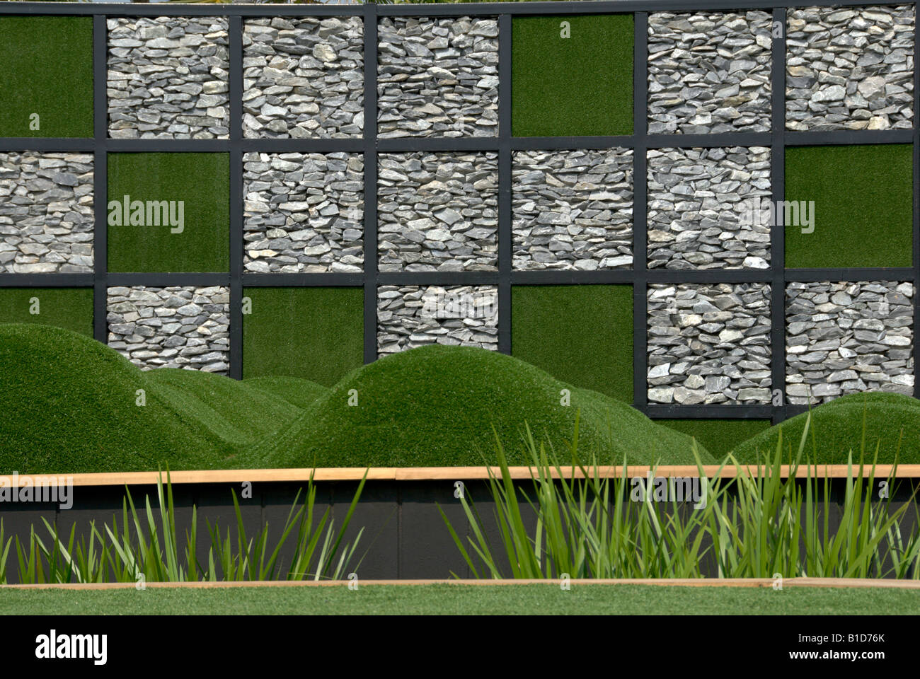 Designer garden featuring small grassy mounds and a checker patterned ...
