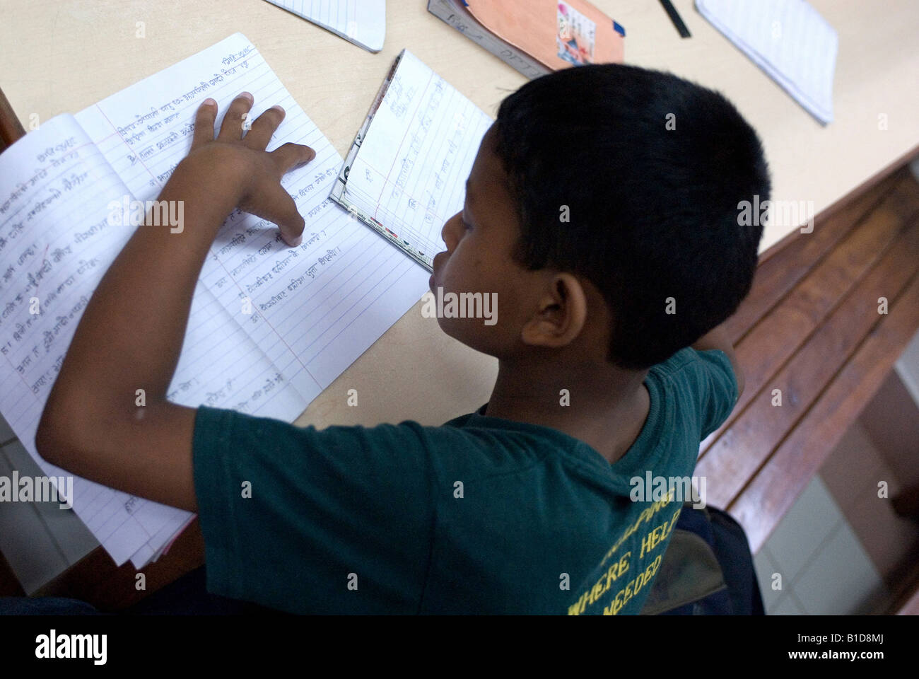 Young boy reading from an exercise book, Kathmandu, Nepal Stock Photo ...