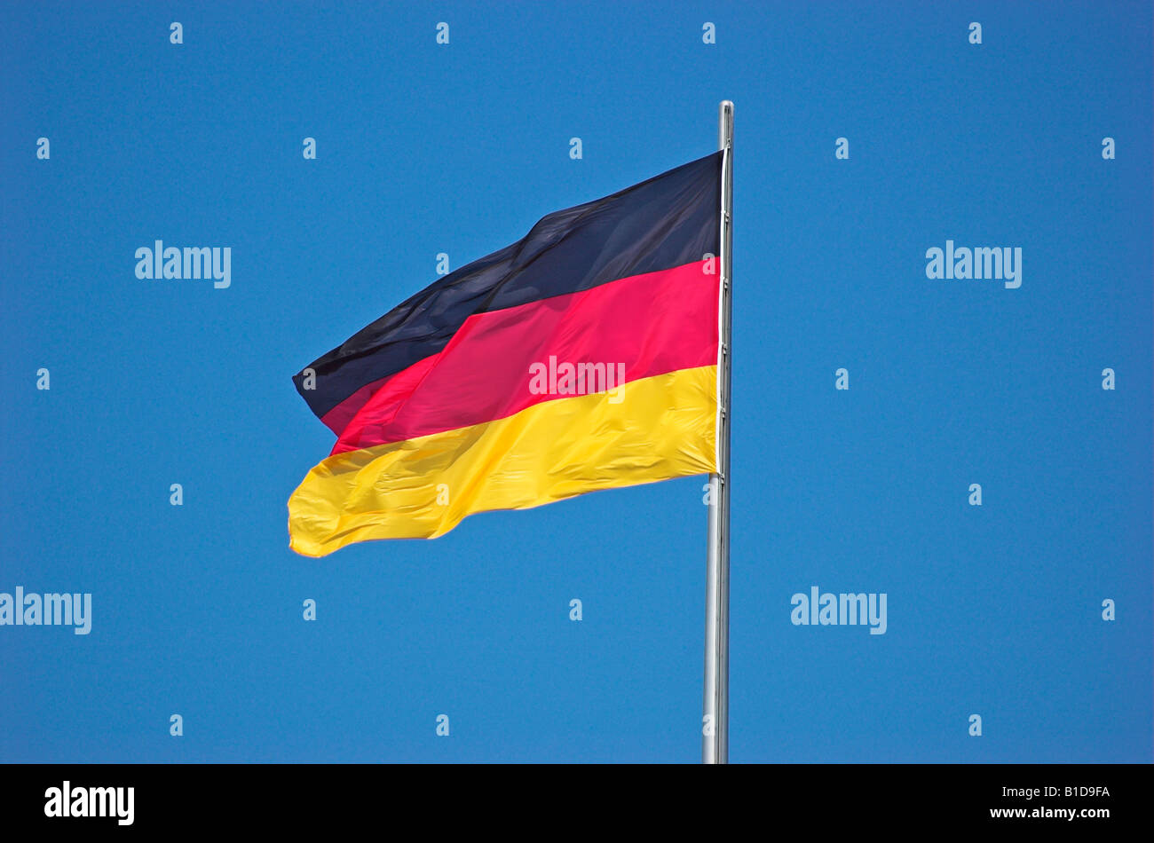 German Flag against blue sky Stock Photo Alamy