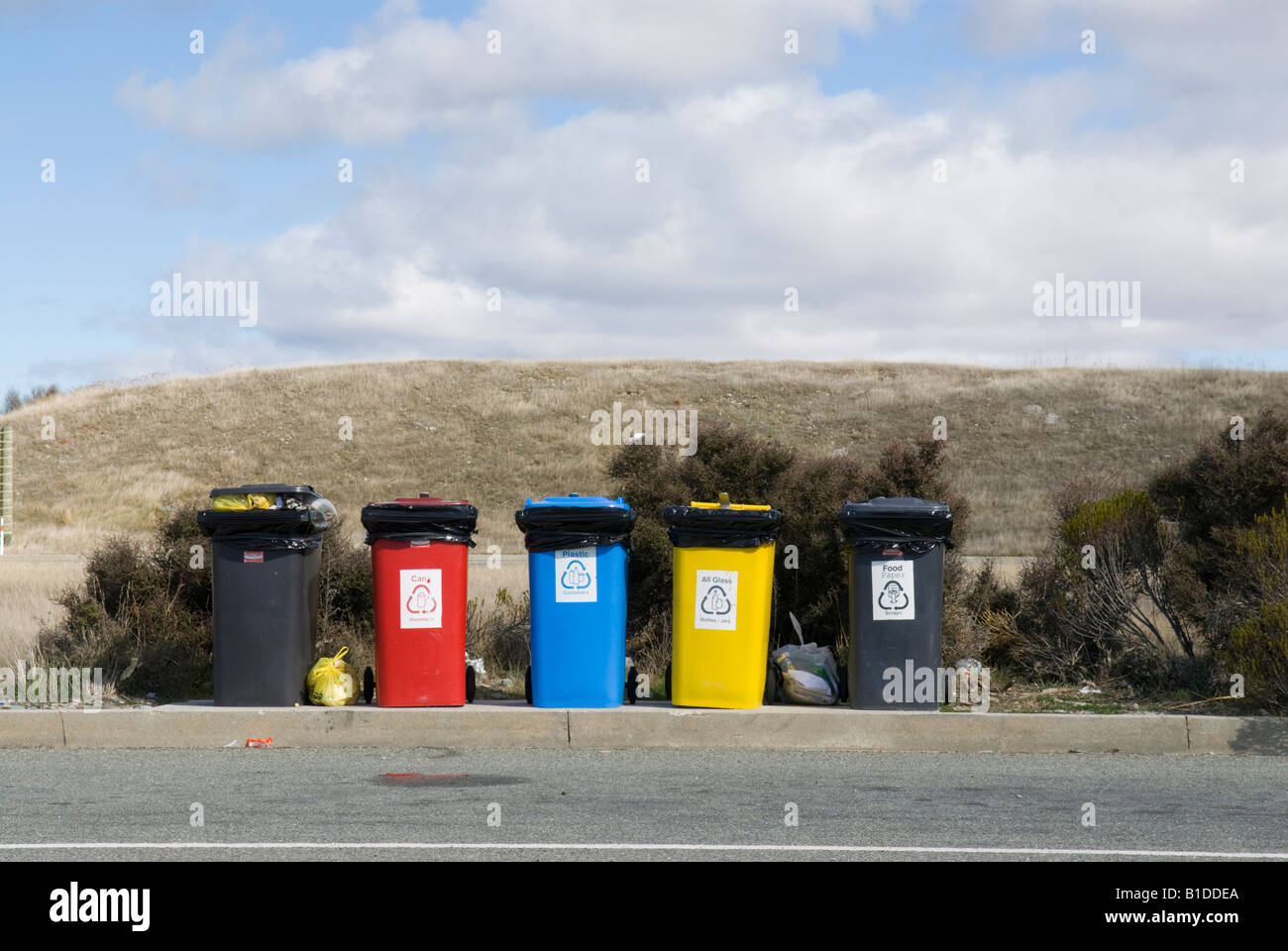 Coloured recycling bins for sorting waste Stock Photo