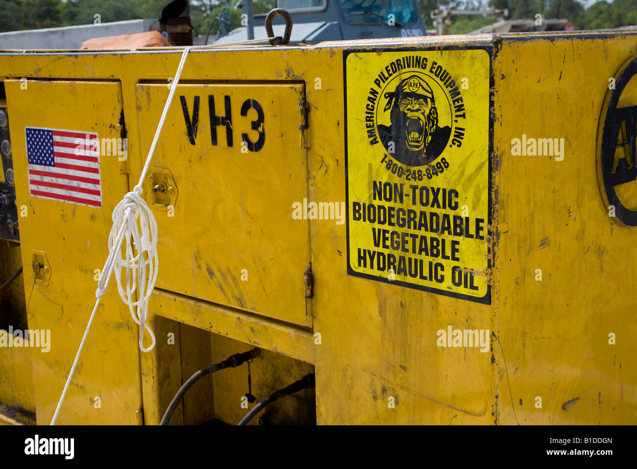Sign indicating hydraulic pile driving equipment uses nontoxic
