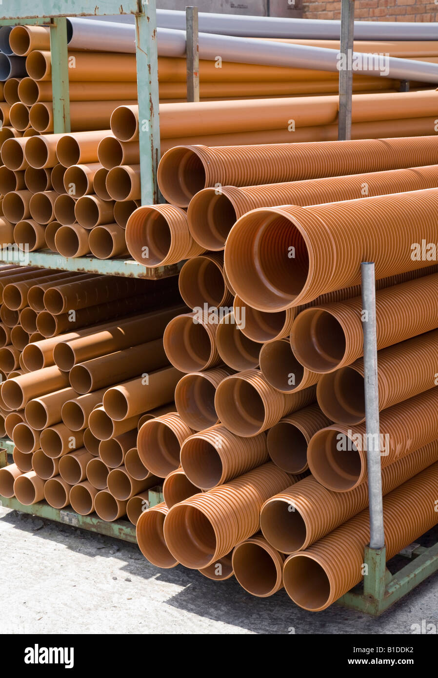 Rack of plastic pipes in builders merchant yard UK Stock Photo Alamy
