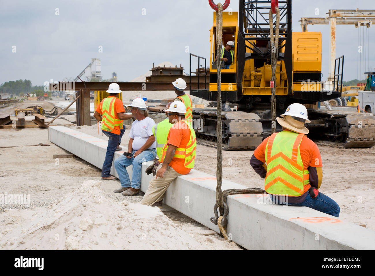 Construction crew taking a break after rigging a precast prestressed